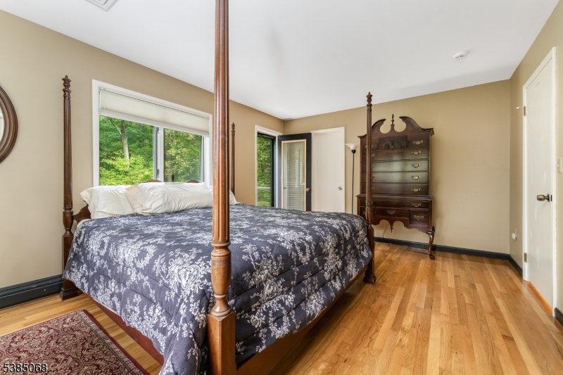 168 Locktown Sergeantsville Road Stockton, NJ 08559 - Photo 19 of 30 a bedroom with a bed dresser and a window