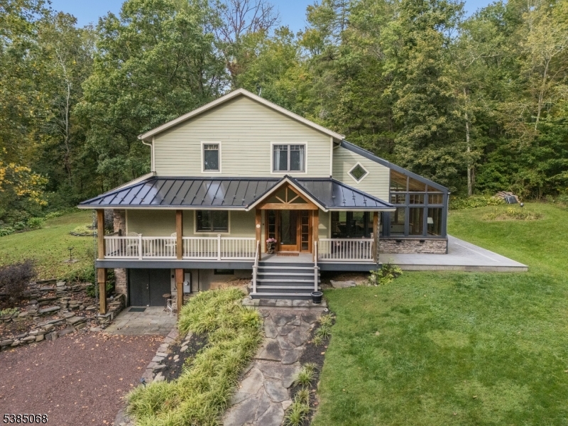 168 Locktown Sergeantsville Road Stockton, NJ 08559 - Photo 2 of 30 a front view of a house with a yard