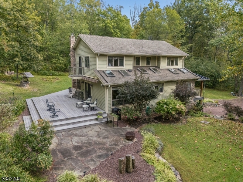 168 Locktown Sergeantsville Road Stockton, NJ 08559 - Photo 27 of 30 a aerial view of a house with a yard table and chairs
