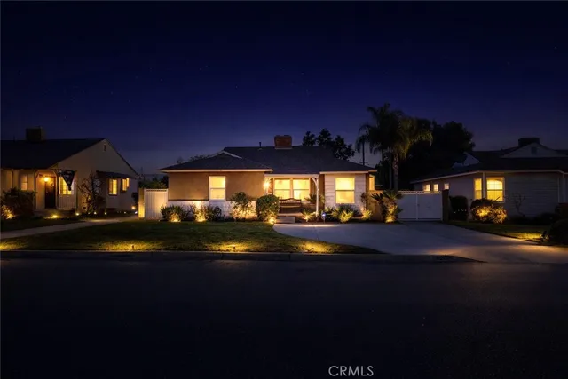 a view of street with night stand and trees