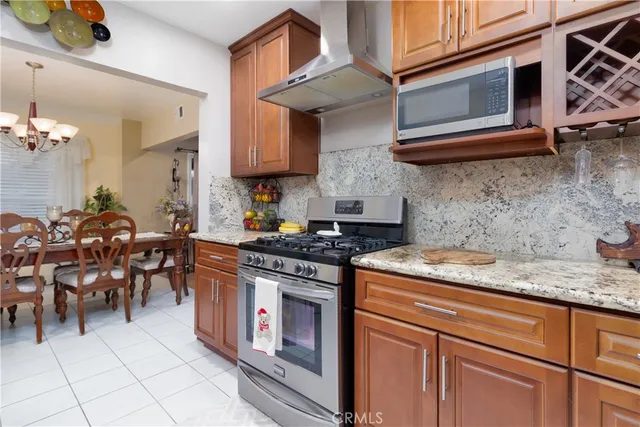 a kitchen with stainless steel appliances granite countertop a stove and a sink