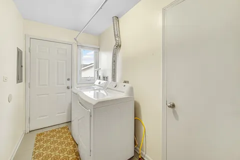 a bathroom with a sink a mirror and a shower