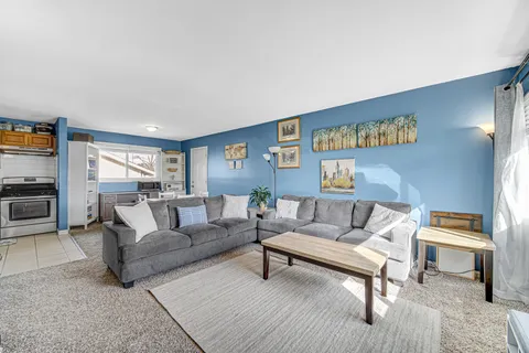 a living room with furniture and a rug