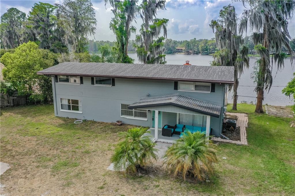 18430 Wayne Road Odessa, FL 33556 - Photo 1 of 1 a front view of house with yard and trees