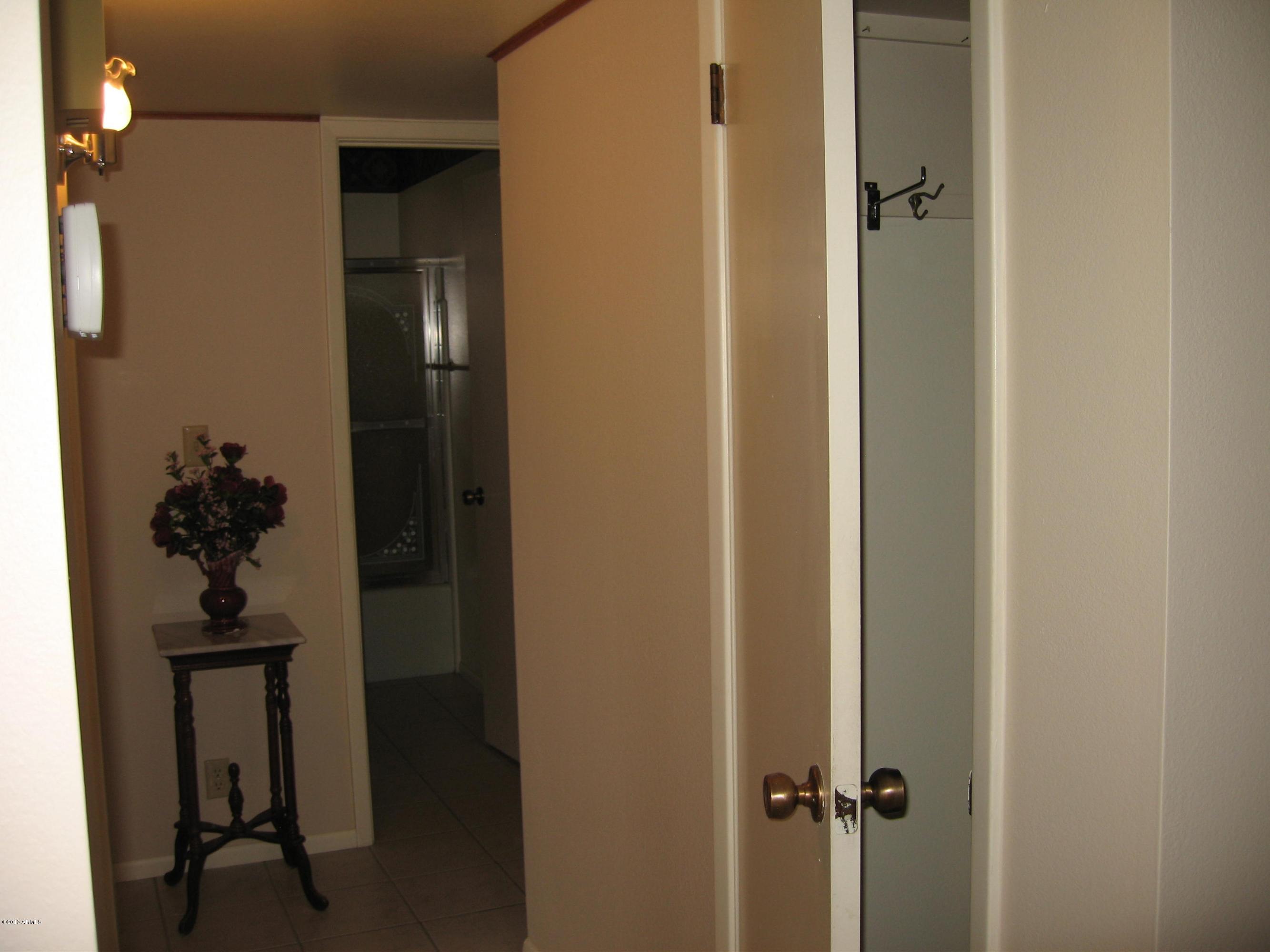 6529 East Decatur Street Mesa, AZ 85205 - Photo 12 of 50 Coat Closet & Hallway to Bedrooms