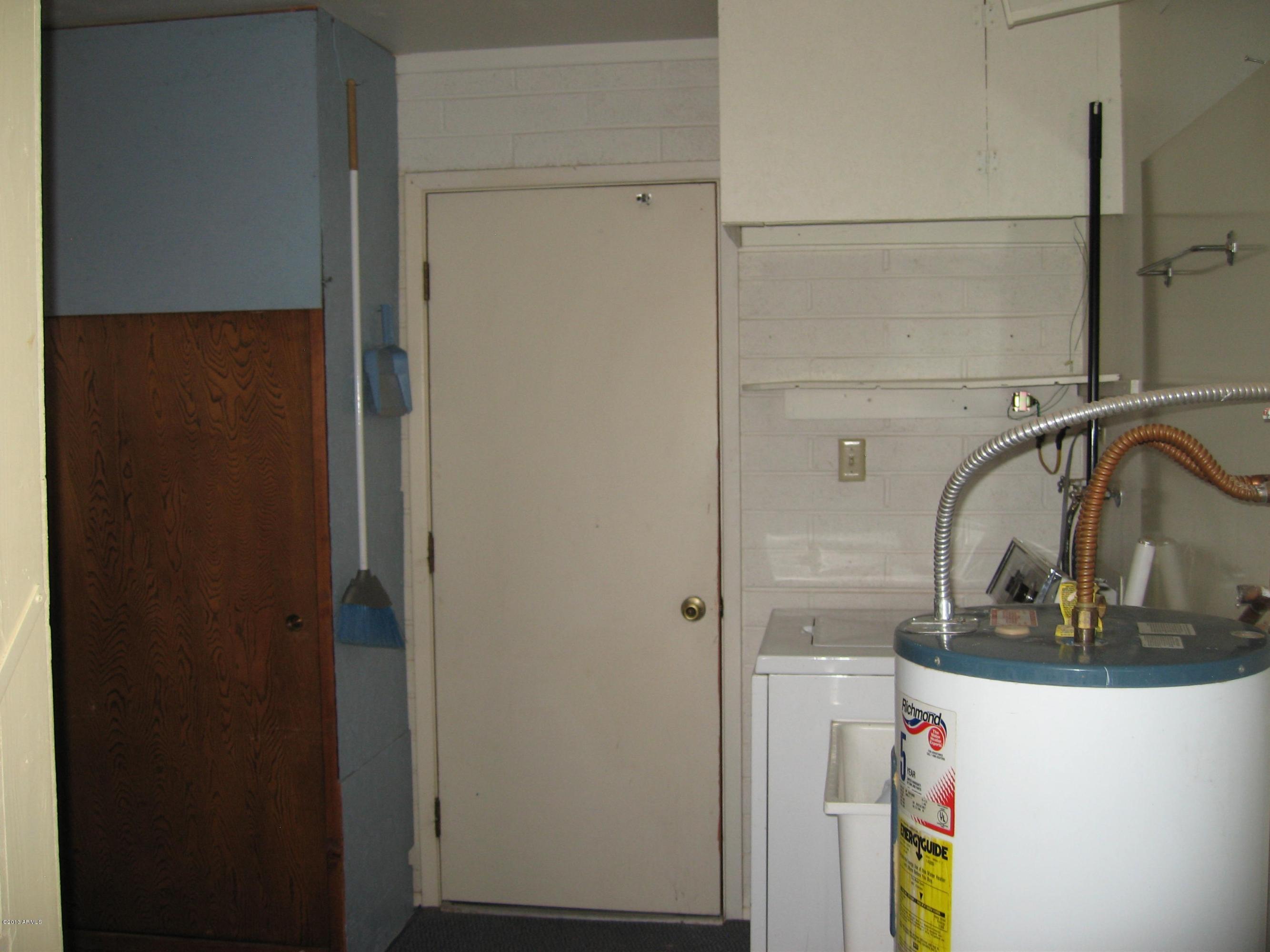6529 East Decatur Street Mesa, AZ 85205 - Photo 25 of 50 Laundry Room Door Leading to Garage