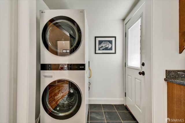 a view of a hallway with washer and dryer