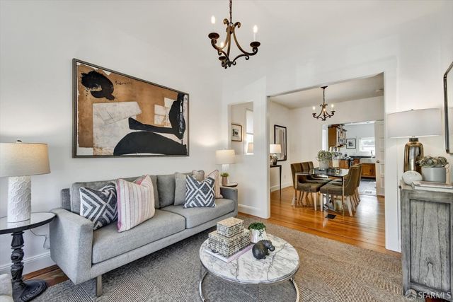 a living room with furniture and a table