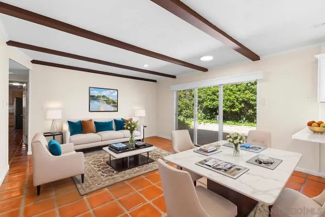 a bedroom with a balcony a bed and a flat screen tv