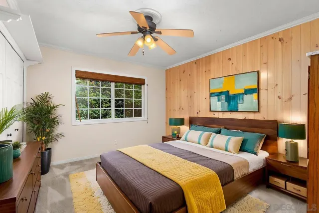 a bathroom with a granite countertop sink mirror toilet and bathtub