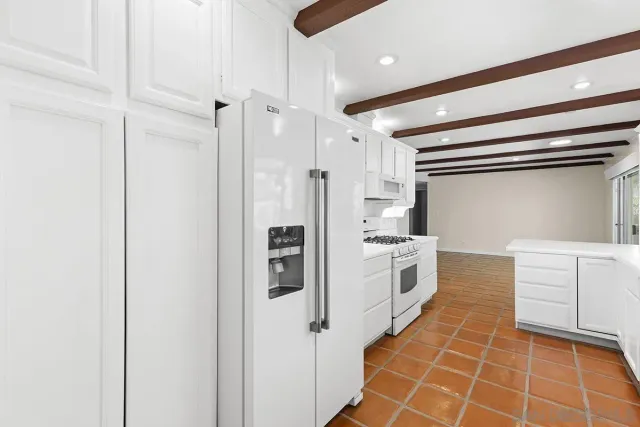 a view of a swimming pool with a yard