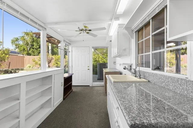 a view of a pathway both side of house