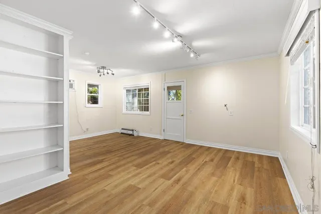an aerial view of residential houses with outdoor space and street view