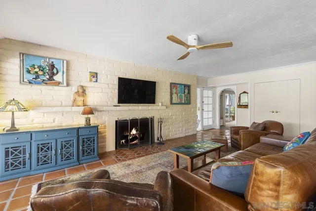 a view of a kitchen with white cabinets and white appliances