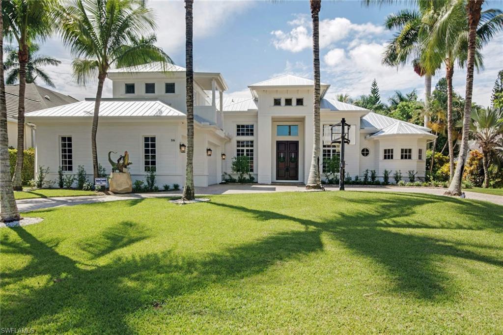 a swimming pool with outdoor seating and yard