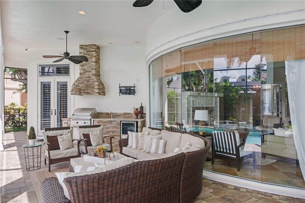 516 Portside Drive Naples, FL 34103 - Photo 14 of 25 a living room with furniture and a large window