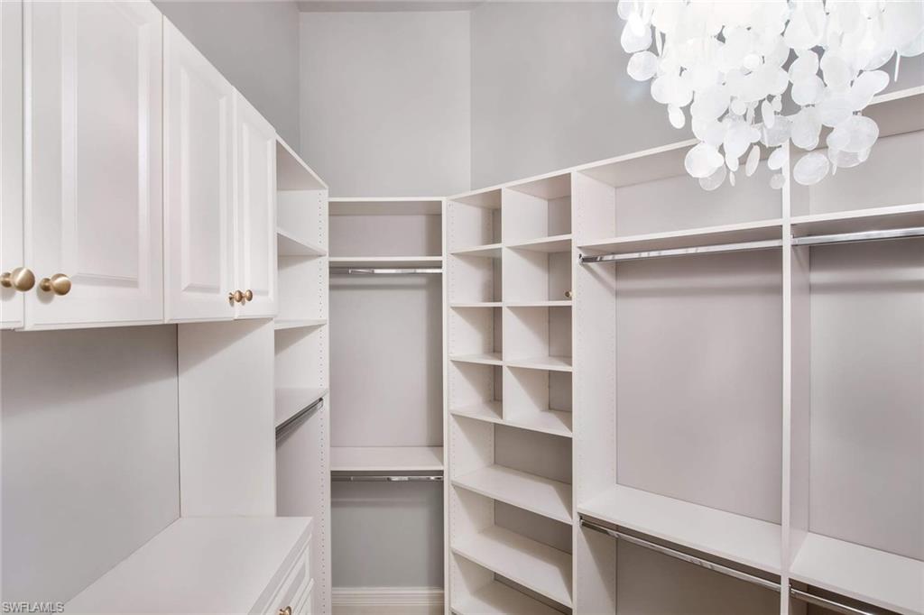 516 Portside Drive Naples, FL 34103 - Photo 19 of 25 a view of a hallway with closet
