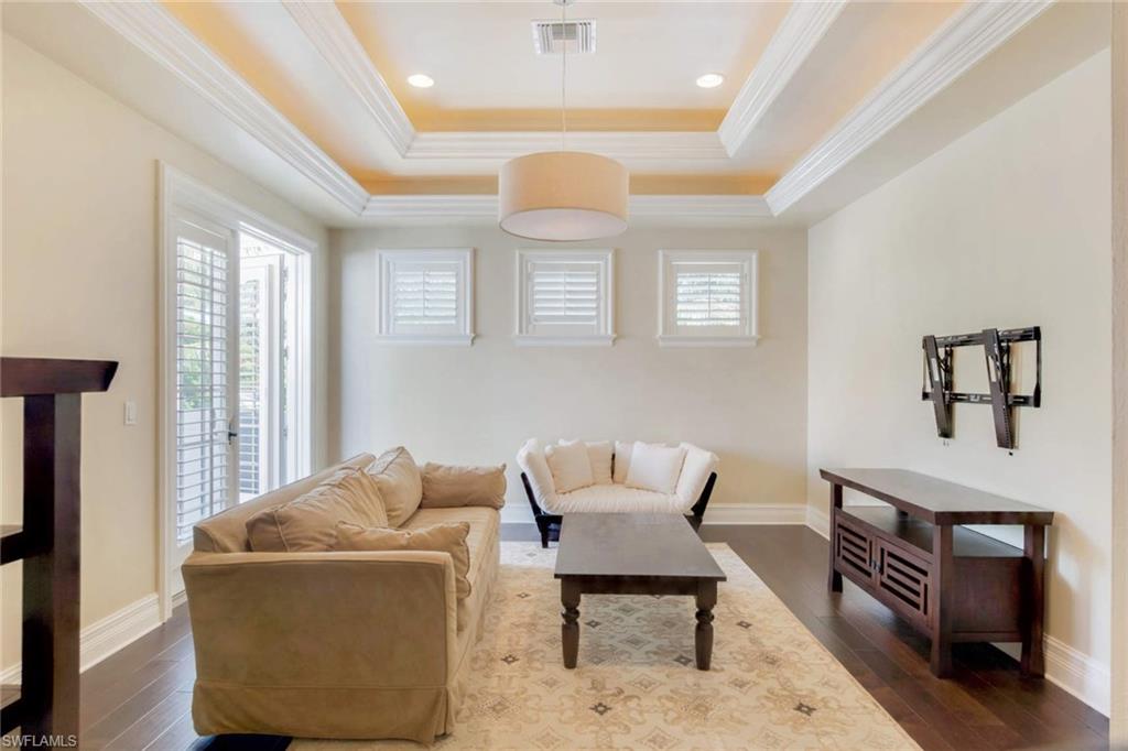 516 Portside Drive Naples, FL 34103 - Photo 23 of 25 a living room with furniture and a window