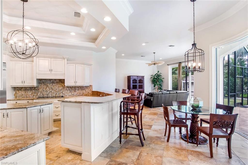 516 Portside Drive Naples, FL 34103 - Photo 9 of 25 a view of dining table and chairs