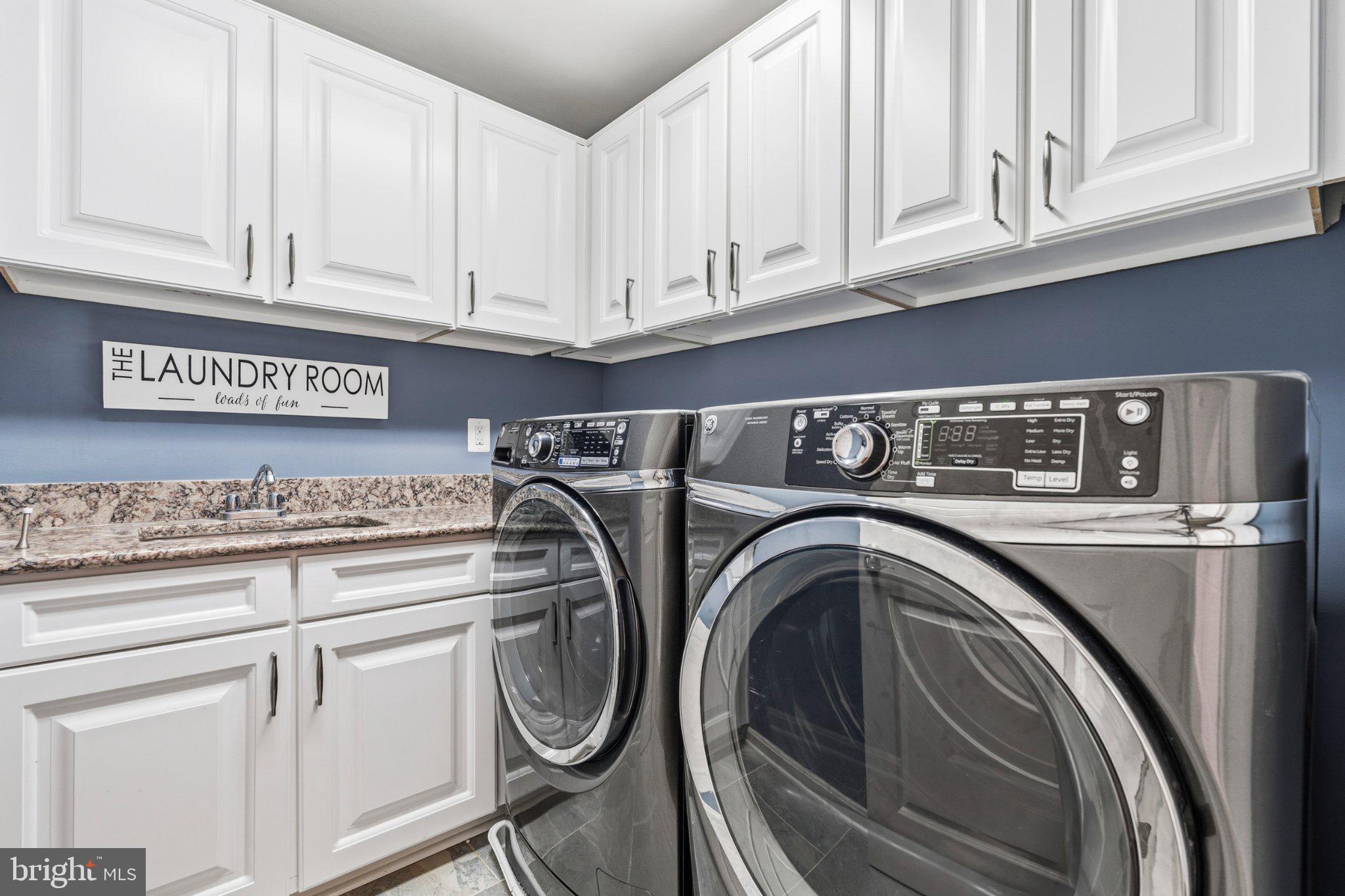 731 Holden Road Frederick, MD 21701 - Photo 47 of 78 Sleek laundry room with modern appliances.