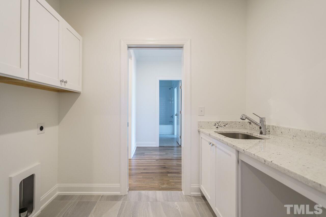 1429 Blantons Creek Drive Wake Forest, NC 27587 - Photo 11 of 40 a bathroom with a sink and a mirror