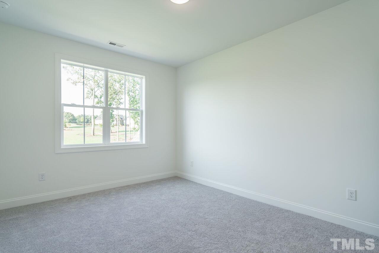 1429 Blantons Creek Drive Wake Forest, NC 27587 - Photo 13 of 40 an empty room with a window
