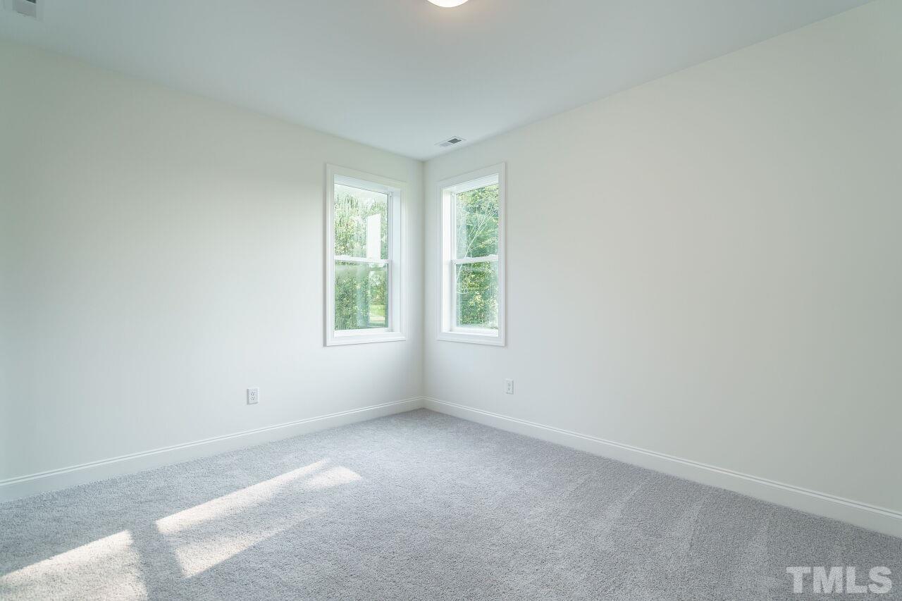 1429 Blantons Creek Drive Wake Forest, NC 27587 - Photo 14 of 40 an empty room with windows