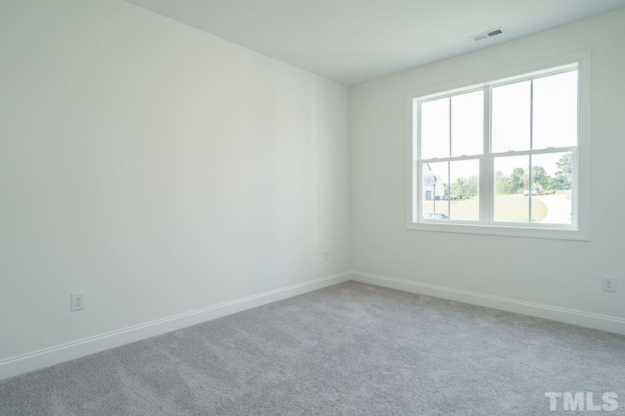 1429 Blantons Creek Drive Wake Forest, NC 27587 - Photo 17 of 40 an empty room with a window