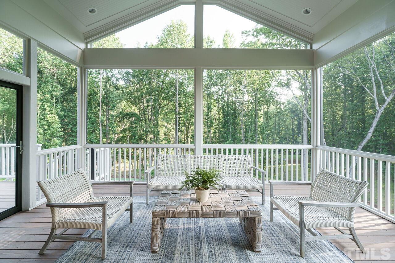 1429 Blantons Creek Drive Wake Forest, NC 27587 - Photo 2 of 40 a view of a chair and table in the balcony