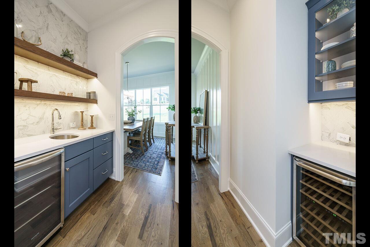 1429 Blantons Creek Drive Wake Forest, NC 27587 - Photo 31 of 40 a view of a kitchen from the hallway