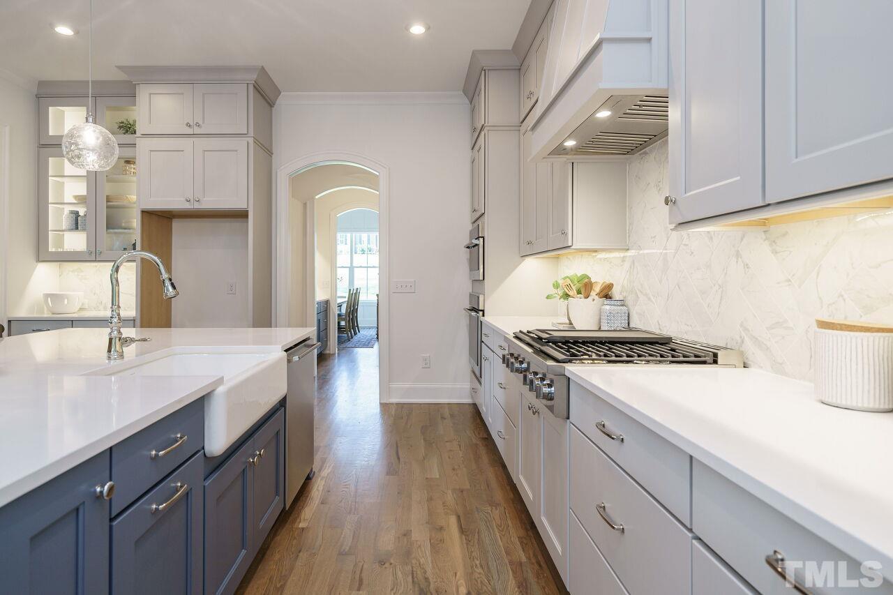 1429 Blantons Creek Drive Wake Forest, NC 27587 - Photo 35 of 40 a kitchen with a stove and a sink