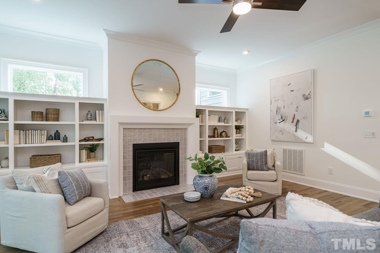 1429 Blantons Creek Drive Wake Forest, NC 27587 - Photo 39 of 40 a living room with furniture and a fireplace