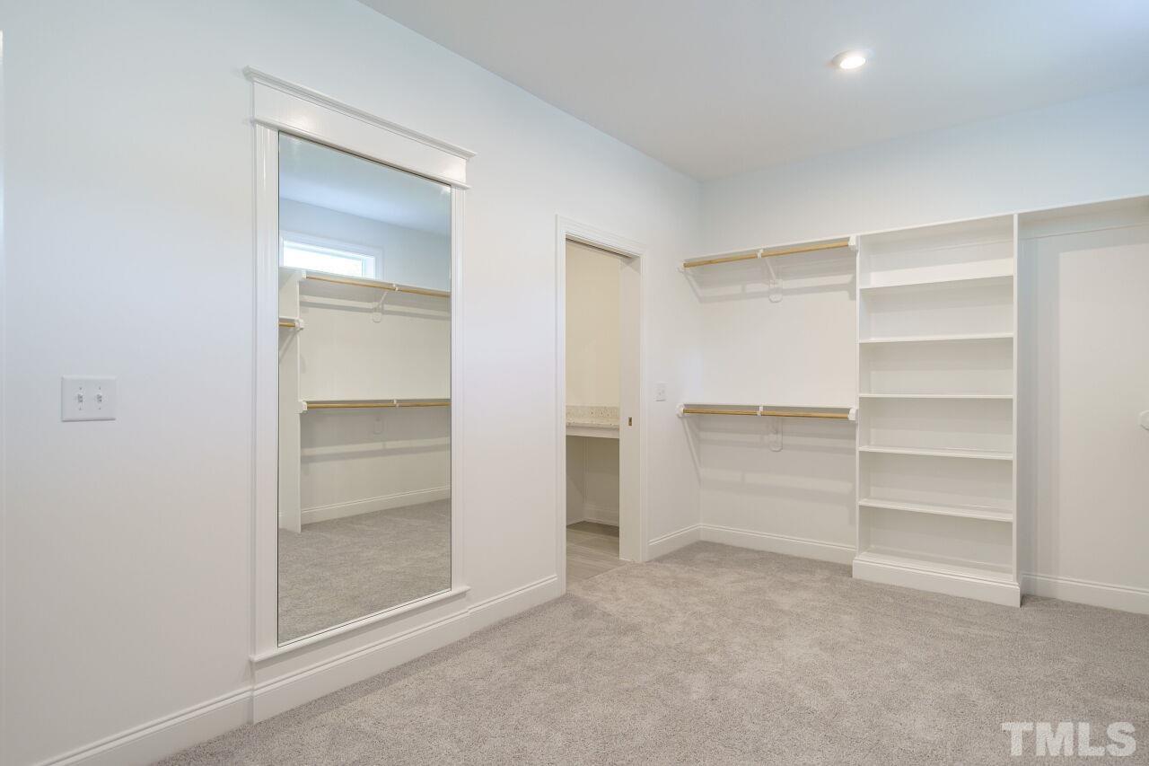 1429 Blantons Creek Drive Wake Forest, NC 27587 - Photo 10 of 40 a view of walk in closet with empty racks