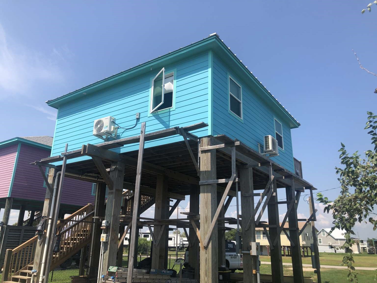 1021 North Sage Road Crystal Beach, TX 77650 - Photo 3 of 7 a view of a house with yard and deck