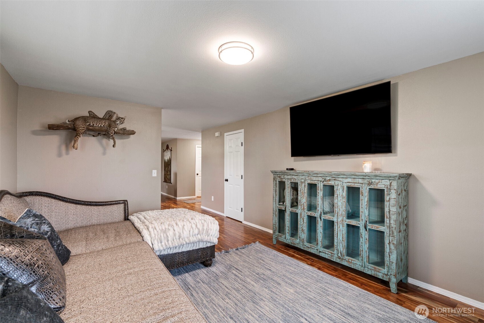 140 Garrett Loop Chehalis, WA 98532 - Photo 13 of 38 a bedroom with furniture and a flat screen tv