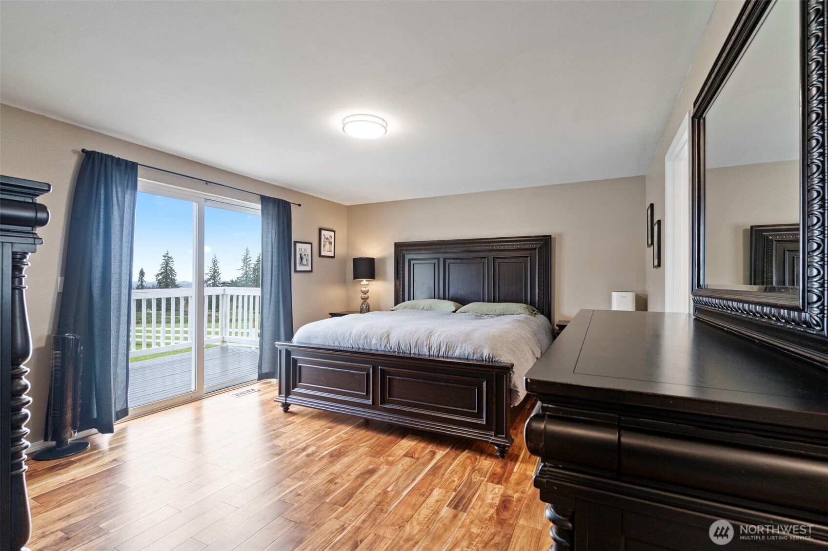 140 Garrett Loop Chehalis, WA 98532 - Photo 19 of 38 a bedroom with a bed and wooden floor