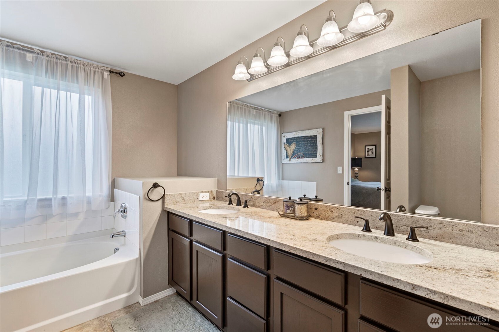 140 Garrett Loop Chehalis, WA 98532 - Photo 21 of 38 a bathroom with a tub double sink and mirror
