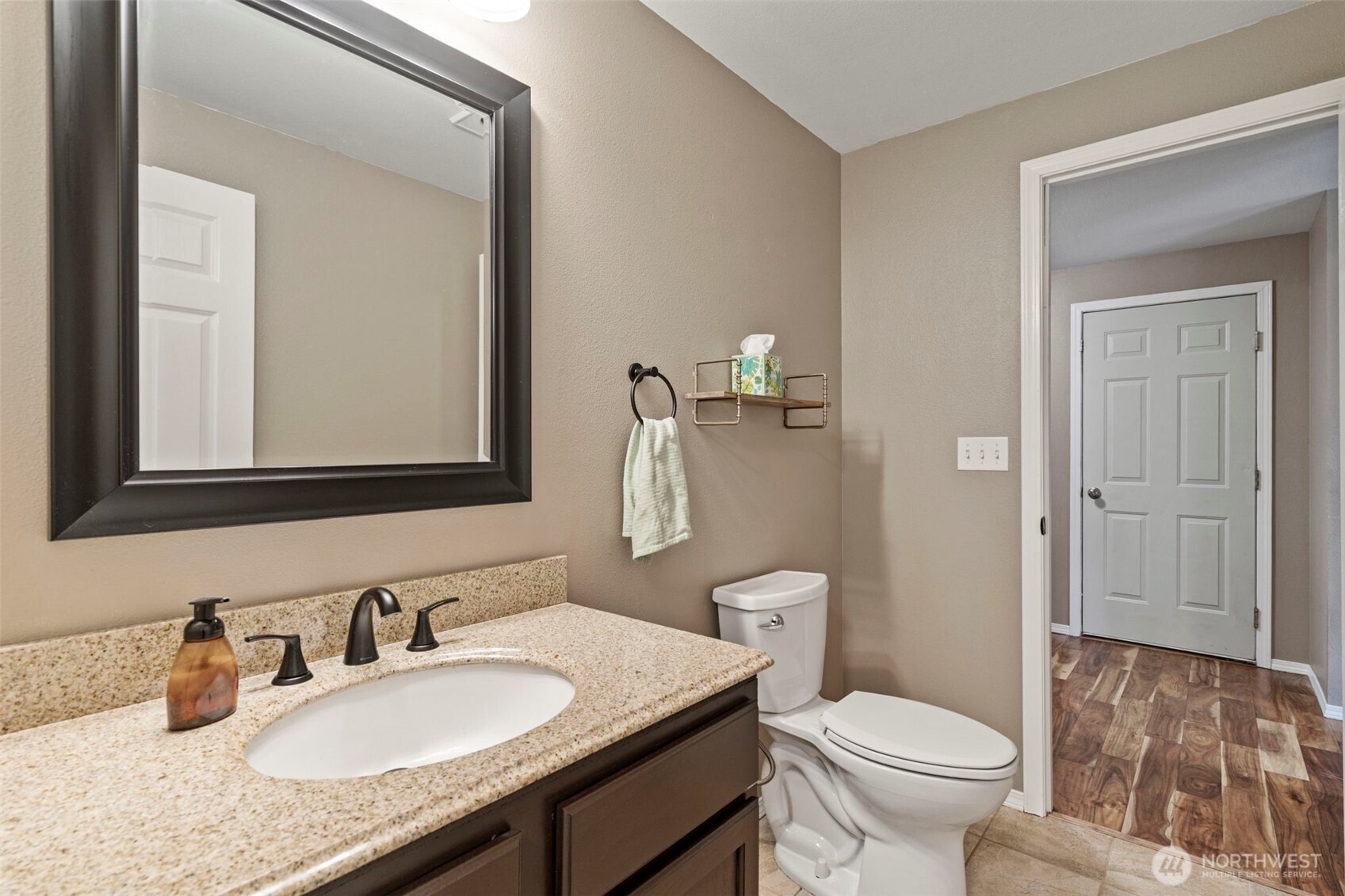 140 Garrett Loop Chehalis, WA 98532 - Photo 24 of 38 a bathroom with a granite countertop toilet sink and mirror
