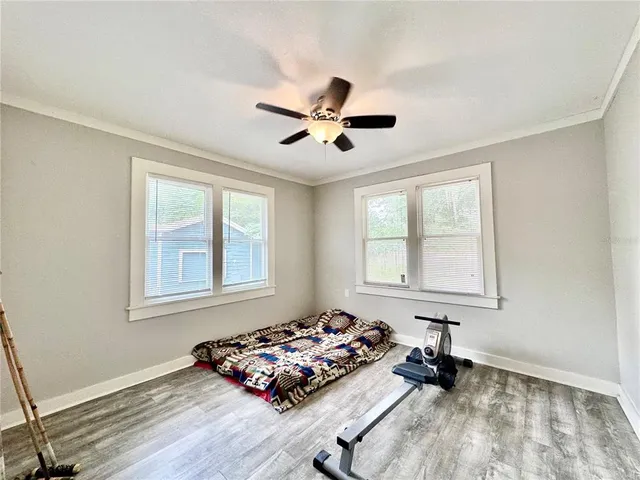 a bedroom with bed and a window