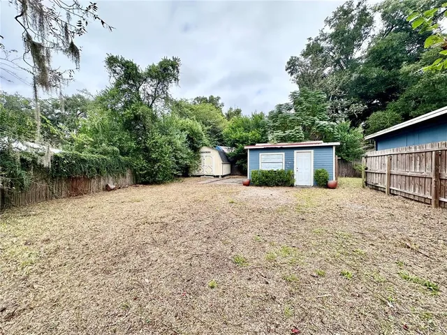 a front view of house with green space