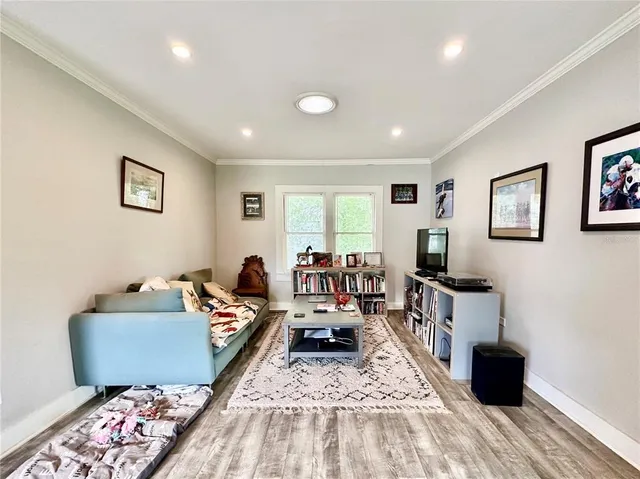 a living room with furniture and a rug