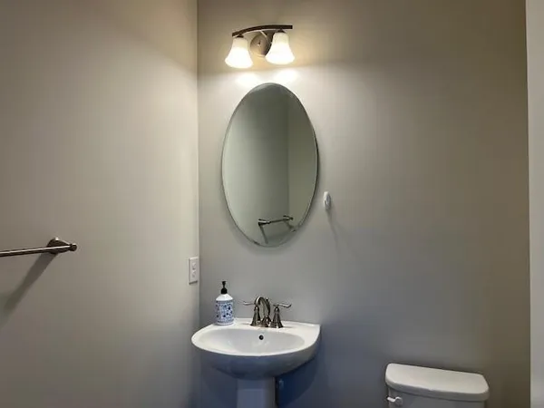 a bathroom with a toilet and a sink