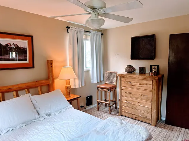 a bedroom with a bed and furniture