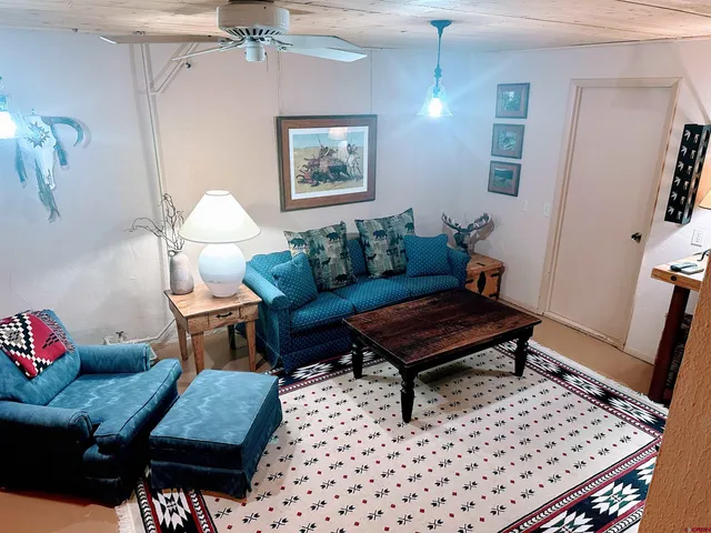 a living room with furniture and a rug