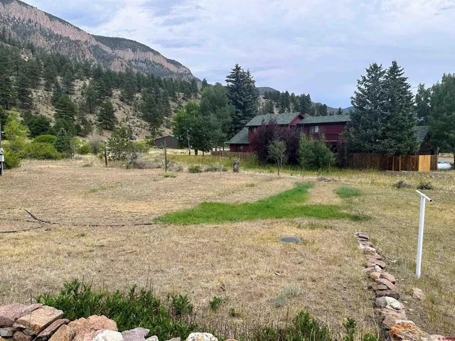 a view of a yard and front view of a house