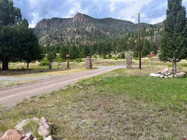 a view of a town with mountains in the background