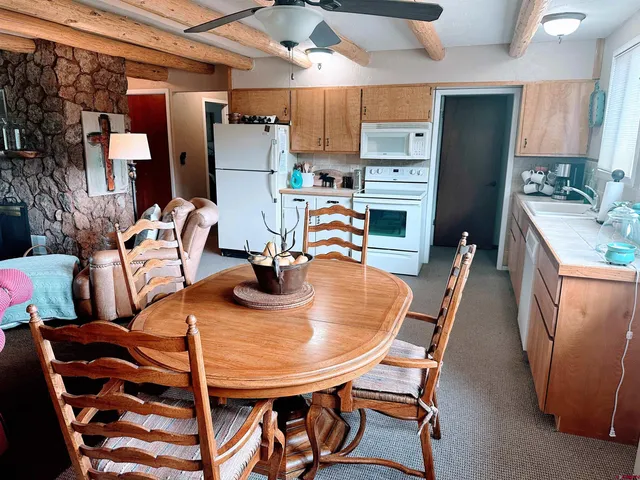 a view of a dining room with furniture
