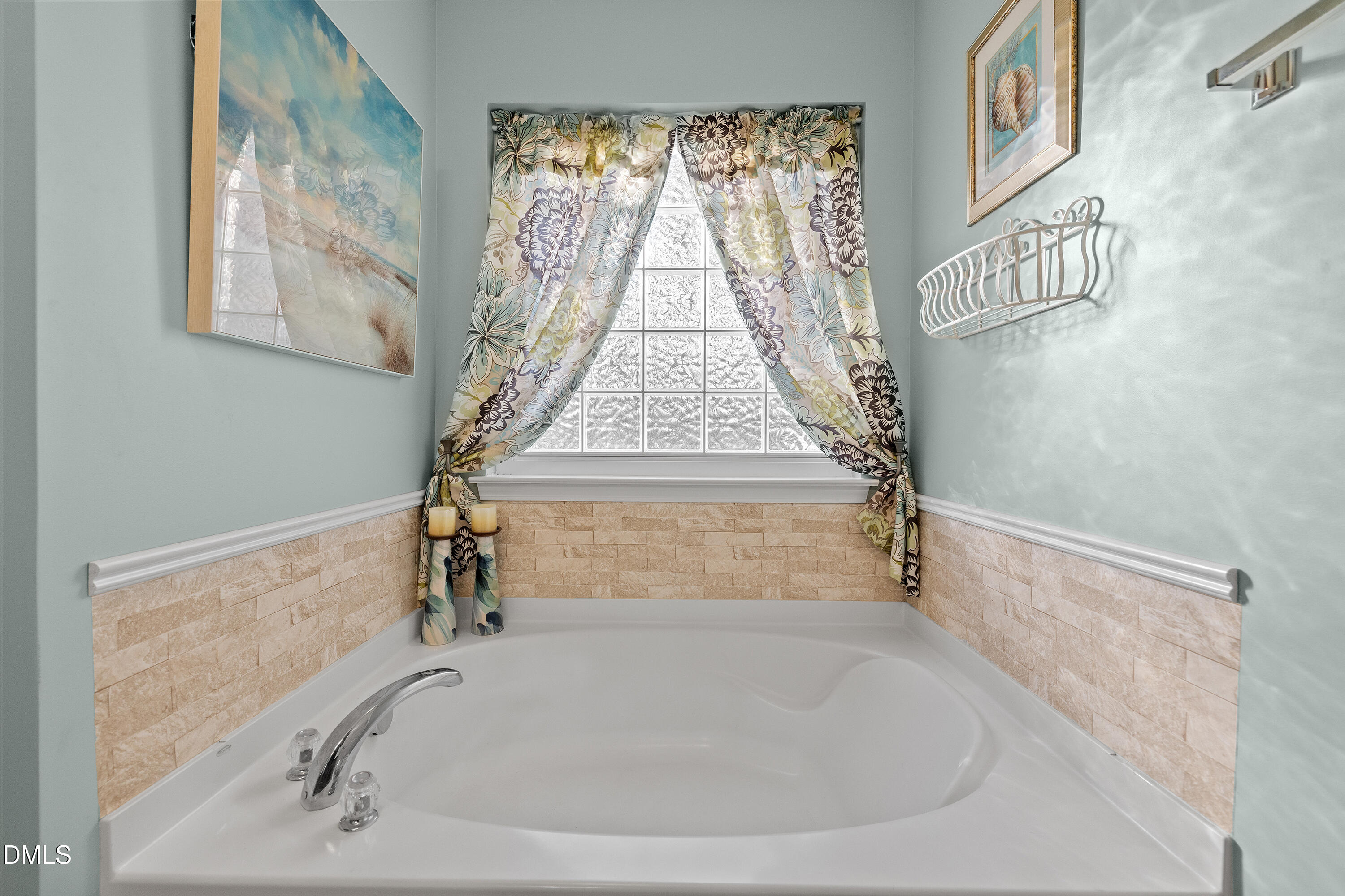7837 Cape Charles Drive Raleigh, NC 27617 - Photo 24 of 43 a bathroom with a bathtub and window