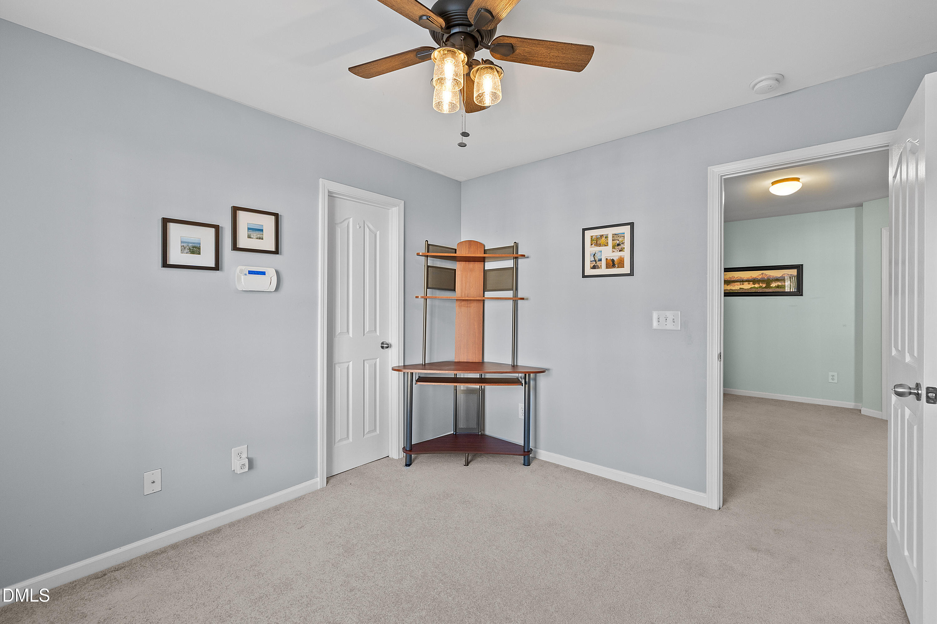 7837 Cape Charles Drive Raleigh, NC 27617 - Photo 25 of 44 an empty room with windows and ceiling fan