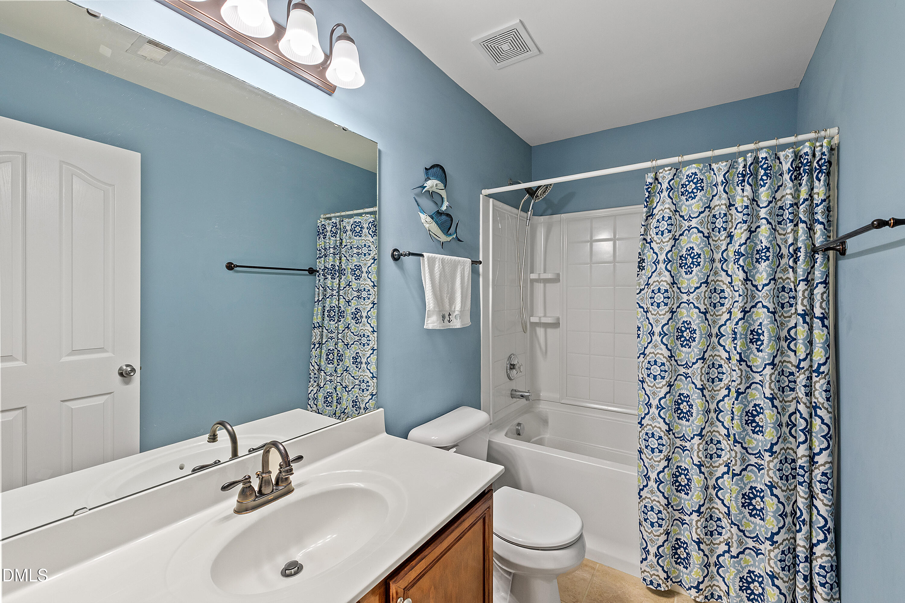 7837 Cape Charles Drive Raleigh, NC 27617 - Photo 26 of 44 a bathroom with a sink a toilet and shower